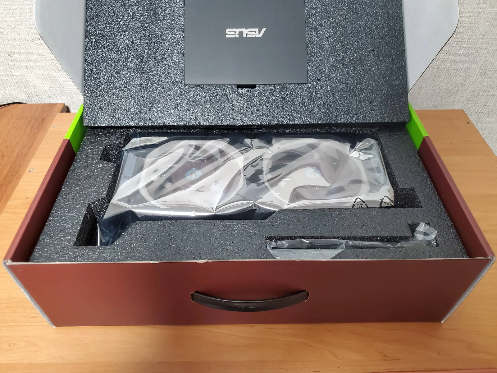 A GPU removed from a computer case and safely stored in its original box